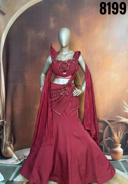 Wine maroon designer lehenga set with embroidered blouse by Fabrani Couture.