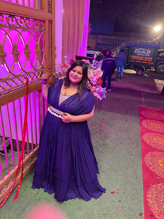 Bridesmaid wearing a custom deep purple Indo-Western draped lehenga by fabrani couture designer 